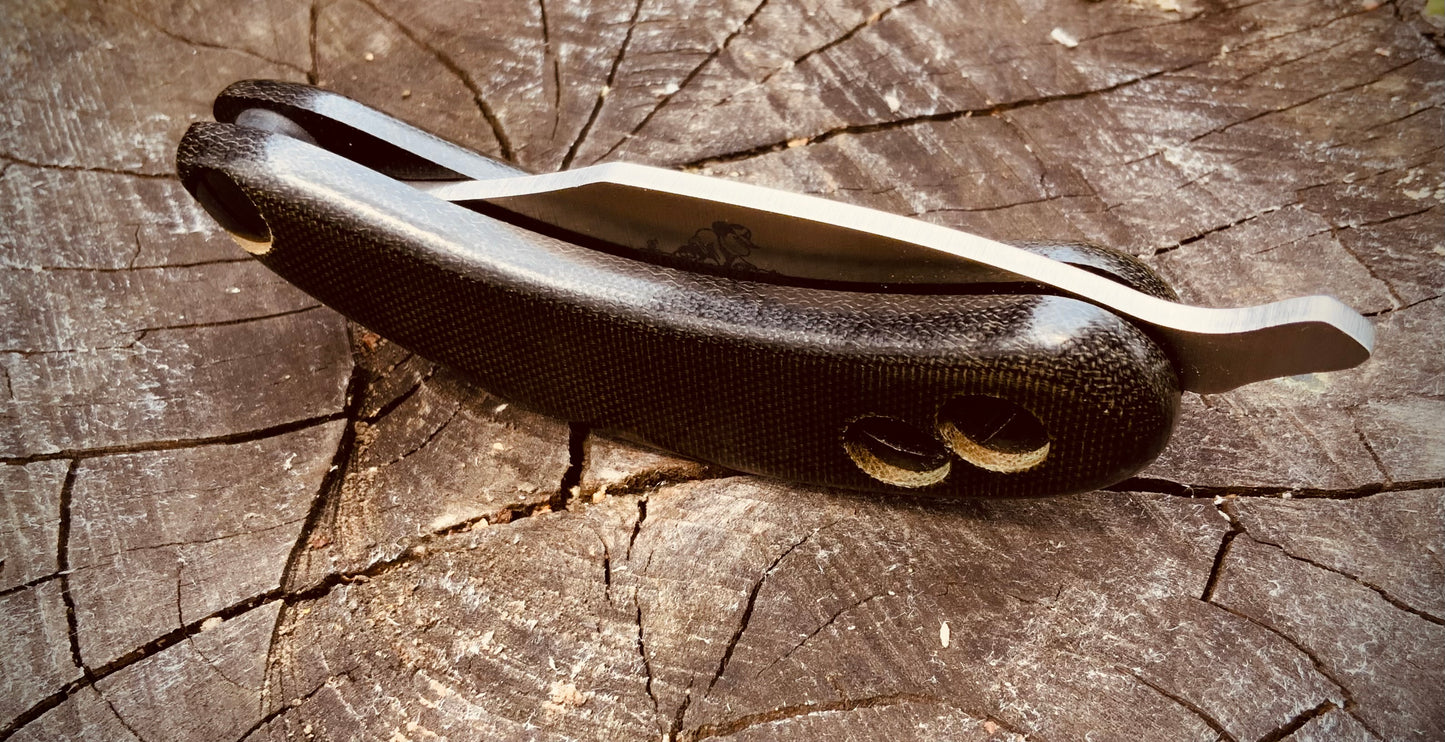 Folded Banana Peel folding knife from Woods Monkey with polished micarta handles