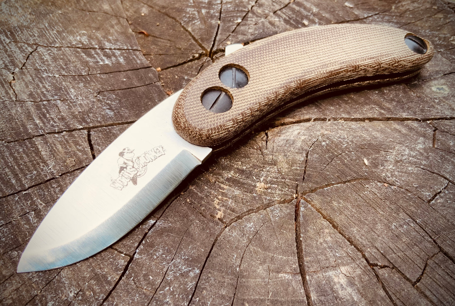 Banana Peel Folder for bushcrafting shown with 2-tone green micarta scales