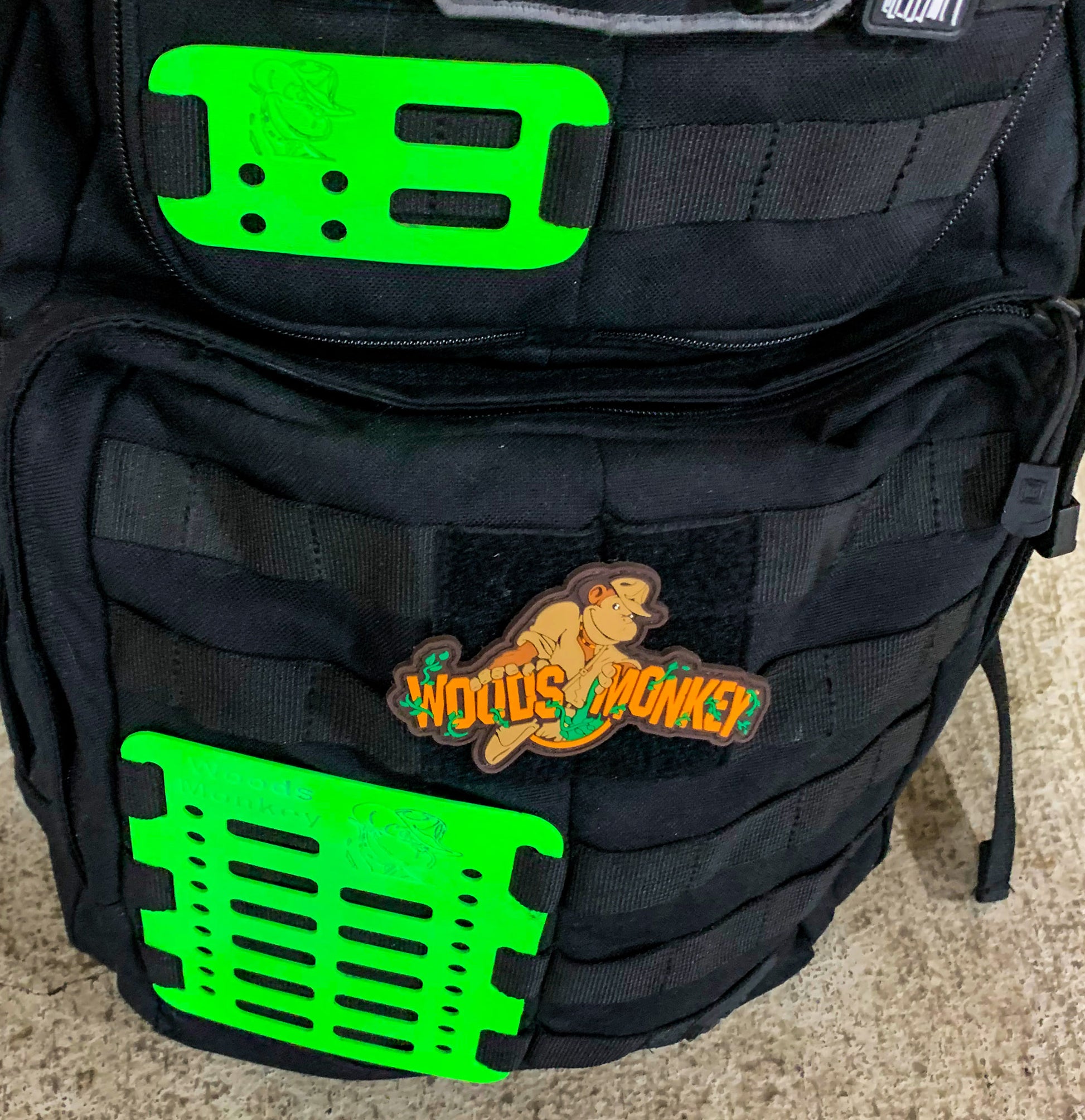 Woods Monkey Mini Monkey Board and Medium Monkey Board on a backpack