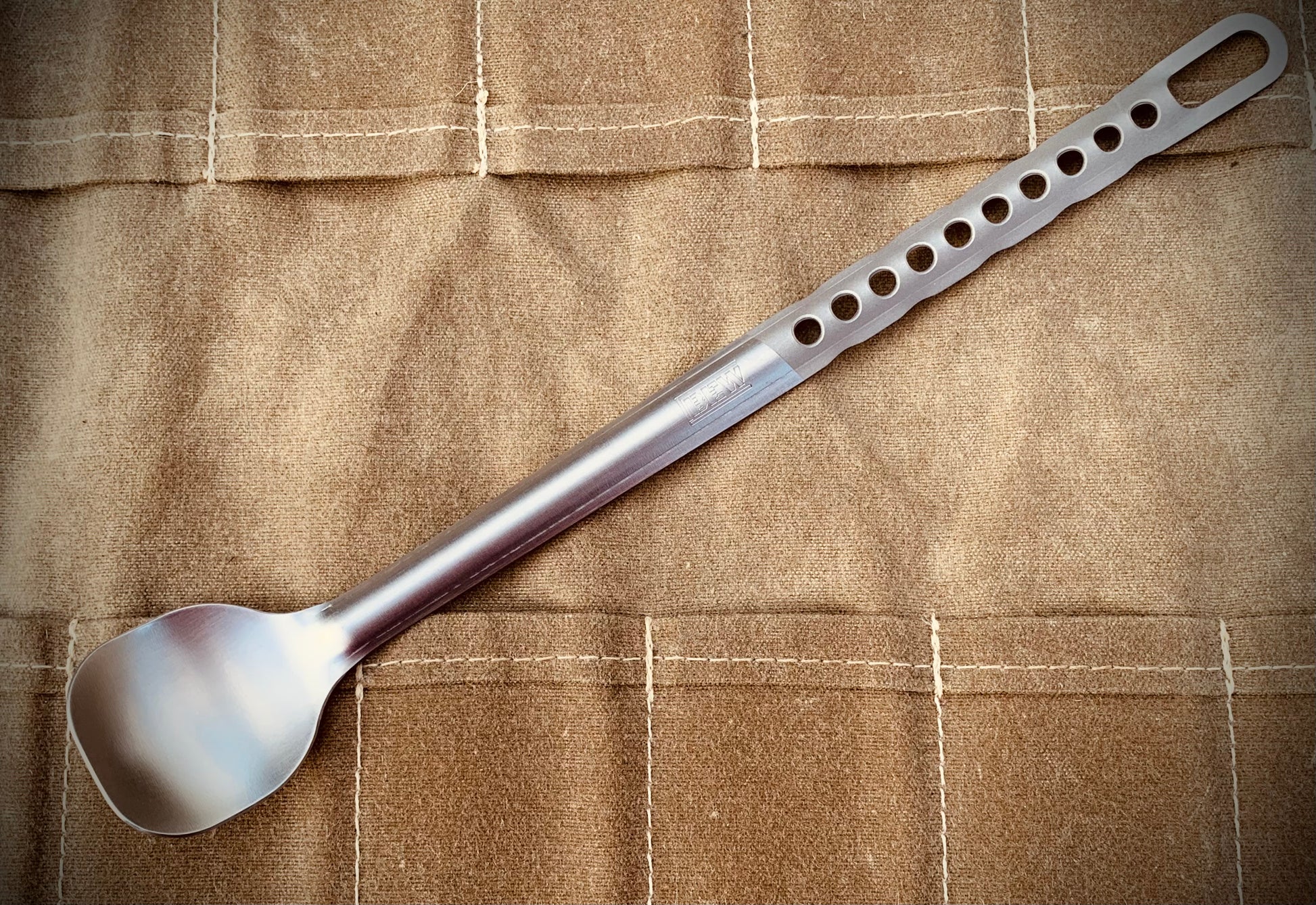Marten Long Titanium Backpacking Spoon shown in raw titanium