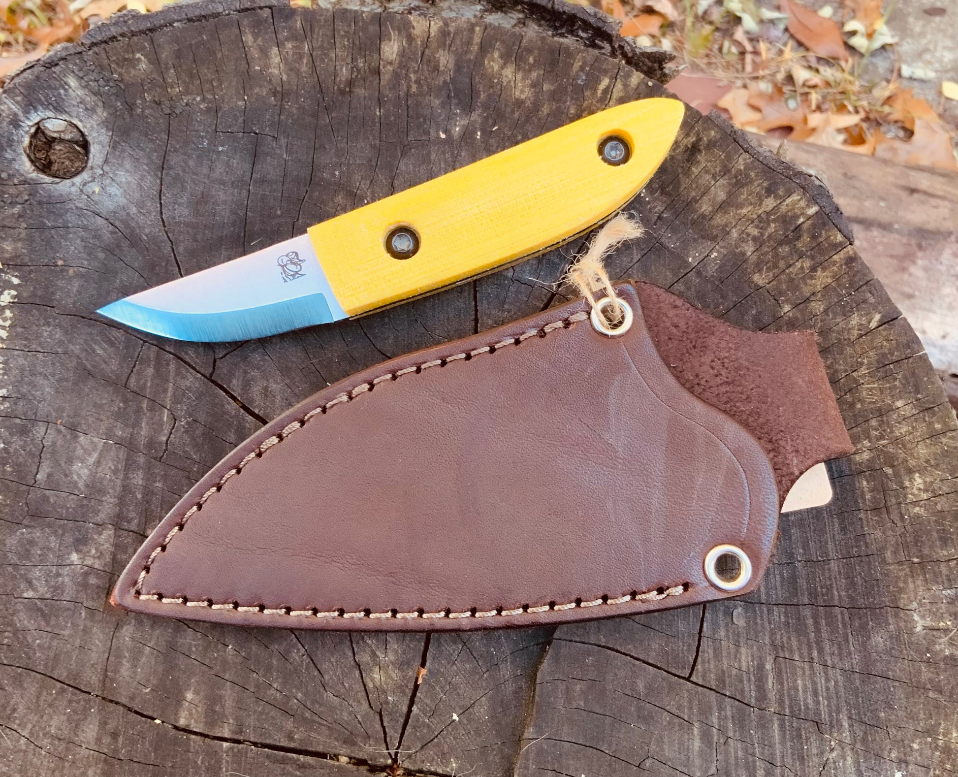 Kerf Carver Knife with Yellow Terotuf scales and leather JRE sheath from Woods Monkey