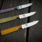 Bonds Creek Knives Fin & Feather, showing three color options on the handle, burgundy, green, and yellow 