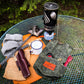 Bushcraft waxed bag with items that fit inside of it