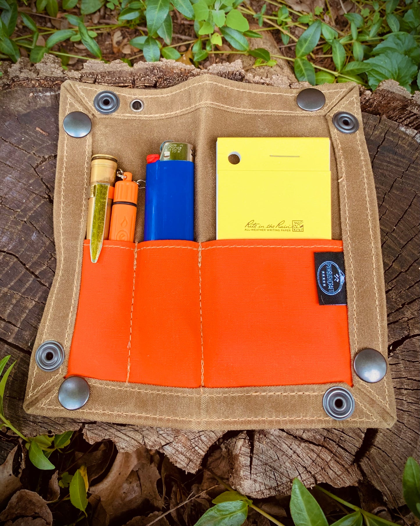EDC Waxed Canvas Travel Tray shown with orange pockets