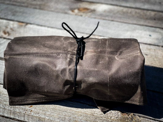 Alder Waxed Canvas 6 Pocket Tool Roll folded for travel or packing in dark brown 