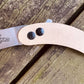 Woods Monkey Banana Peel Neck Knife shown in snakeskin micarta