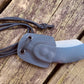Woods Monkey Neck Knife shown in hand molded Kydex neck knife Sheath with paracord 