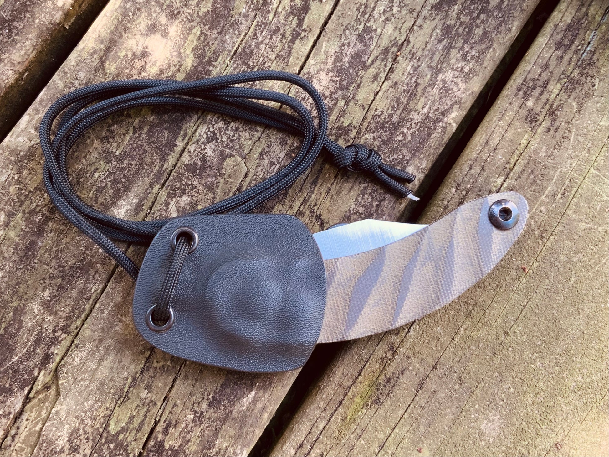 Bushcraft Neck Knife shown in Sheath with cord